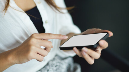 Female using modern smartphone with empty screen