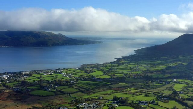 Carlingford Lough, Louth, Ireland, October 2021. Drone pushes west towards Knocknagoran and Omeath with Greenore in the distance.