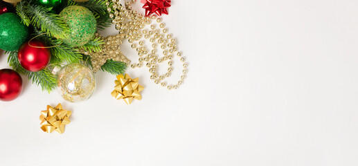 Christmas background with fir branches, red and gold decorations on a white background. Flat lay. top view with copy space. banner