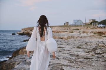 woman traveler enjoying for view of the beautiful sea on her holiday Lifestyle