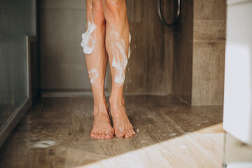Female legs close up in shower
