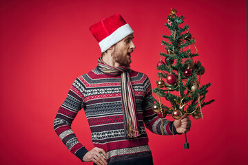 emotional man in New Year's clothes decoration christmas studio posing