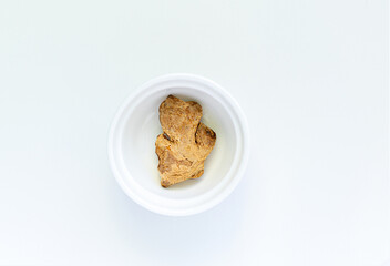 ginger on a white plate, on a white background. High quality photo