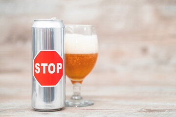 stop sign on a can of beer. concept - limiting alcohol consumption.