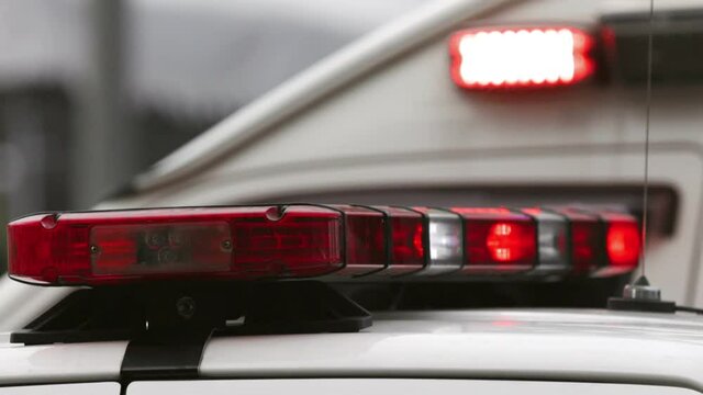 Police car emergency red lights are flashing