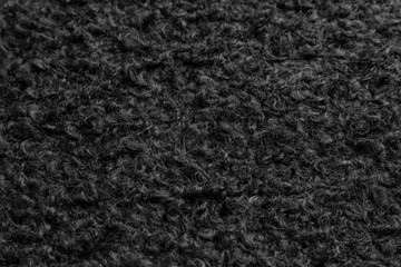 Fototapeta premium black texture background. curly fur. black faux fur. eco lamb wool. black wool.