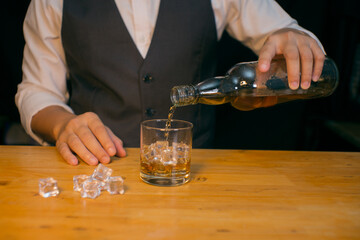 Barman pouring whiskey whiskey glass beautiful night