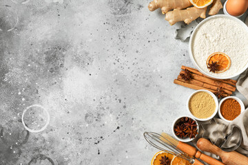 Ingredients for gingerbread cookies on a light gray culinary background. Assortment of food for Christmas or New Year's holiday baking top view. Copyspace