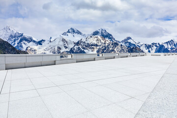 Empty square floor and snow mountain background. - Powered by Adobe