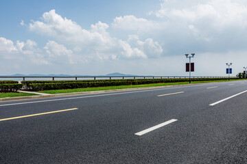 Empty asphalt road and blue sky with white clouds.Road background.