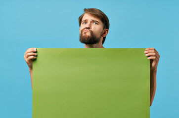 bearded man holding green mockup poster discount isolated background