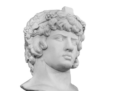 Gypsum copy of famous ancient statue Antinous head isolated on a white background. Plaster antique sculpture young man face. Renaissance epoch. Portrait