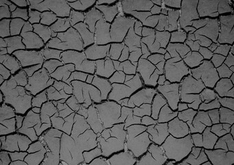 Close up weathered texture of arid cracked ground