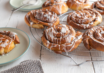 Danish cinnamon rolls. Fresh and homemade baked on a cooling rack