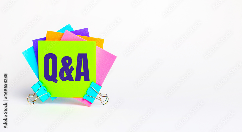 Poster there are bright multi-colored stickers with the text q and a. copy space