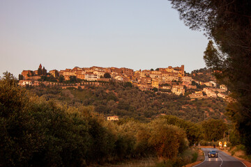 Fototapeta na wymiar a view over the town of Scarlino at sunset. Scarlino is an Italian town in the province of Grosseto in Tuscany.