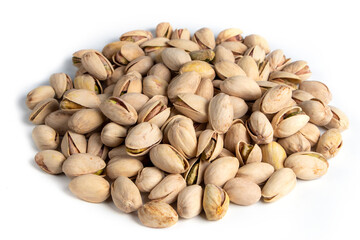 Pile of pistachios in the peel close-up on a white background. Isolated.