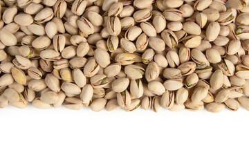 Roasted and salted pistachios in shell on white background copy space