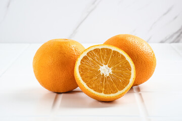 Fresh and ripe sunkist oranges fruits.  Close up and copy space.
