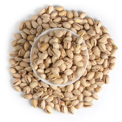 White bowl of pistachios on white background top view