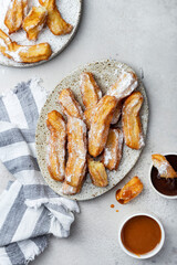 churros in with caramel and chocolate sauces