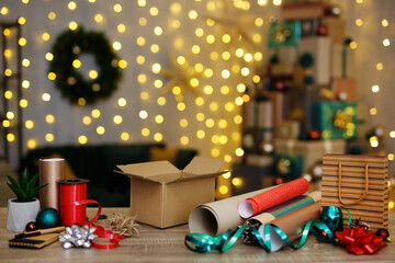 Unprepared christmas present on wooden table with decor elements
