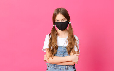 white teenage girl in a black mask on a pink background