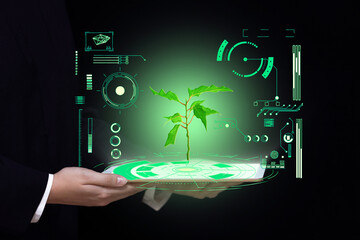biotechnology science and medicine background, hands hold a tablet with a picture of green light plants and digital laboratory research - obrazy, fototapety, plakaty