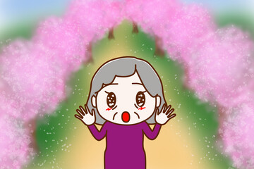 桜並木を見て目を輝かせて感動している高齢の女性