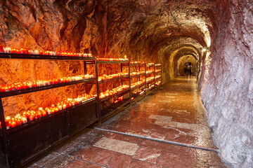 Covadonga sanctuary and cave with candles. Asturias famous heritage. Spain
