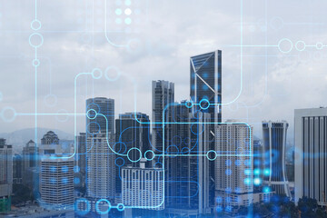 Technology hologram over panorama city view of Kuala Lumpur. KL is the largest tech hub in...