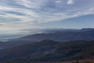 panorama view over the hills in the Vosges / France. The valleys are filled with fog.
