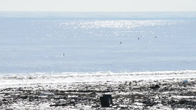 river of mud and water rushes towards the sea after intersting rains