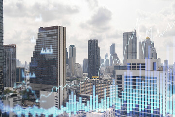 Forex and stock market chart hologram over panorama city view of Bangkok, the financial center in Southeast Asia. The concept of international trading. Double exposure.
