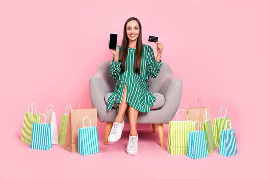 Full size photo of young woman customer purchase credit card paypass mobile shopping isolated over pastel color background