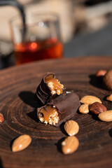 Chocolate candy with caramel and nuts. Close-up. Copy space.