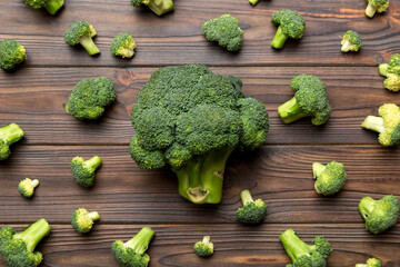 green fresh broccoli background close up on colored table. Vegetables for diet and healthy eating. Organic food