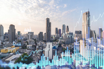 Glowing FOREX graph hologram, aerial panoramic cityscape of Bangkok at sunset. Stock and bond trading in Southeast Asia. The concept of fund management. Double exposure.