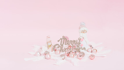 Modern Christmas poster with shiny pink decorations, fairies and balls on a pink background.  Christmas card, invitation, background.