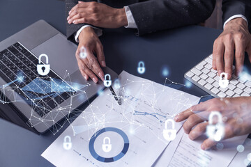 Two businesspeople man and woman working on the project to protect cyber security of international...