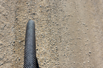 Close up of a gravel bike tire. Adventure on a gravelike bike. Photo taken on a beautiful sunny day.