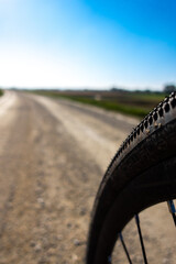 Close up of a gravel bike tire. Adventure on a gravelike bike. Photo taken on a beautiful sunny day.