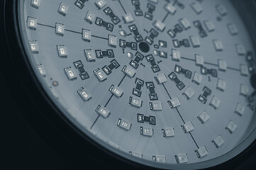 Close-up of the round panel of fito lamps for night illumination of plants. Electronic components on a circuit board. Selective focus