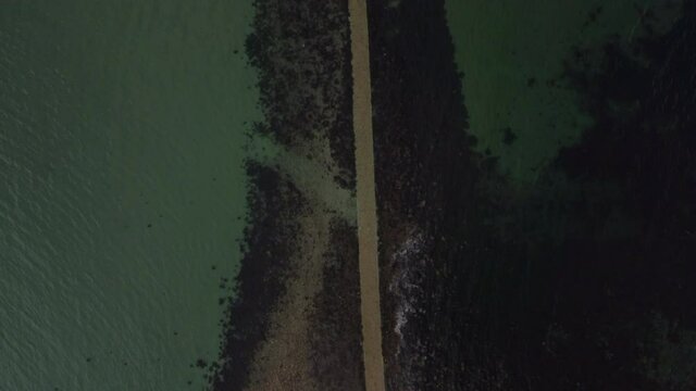 Birdseye View of Submerged Underwater Causeway leading to St Michael's Mount near Penzance in Cornwall, England - Drone Aerial View