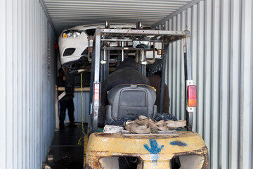 Unloading the car from the container