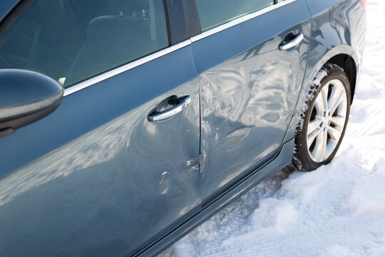 Sheet Metal Damage To Blue Car. Traffic Accident