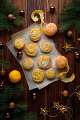 Homemade orange crinkle cookies on dark wooden background. Top view
