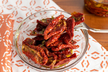 Dry Tomatoes in olive oil. Sun dried tomatoes from Puglia. Italian recipe.