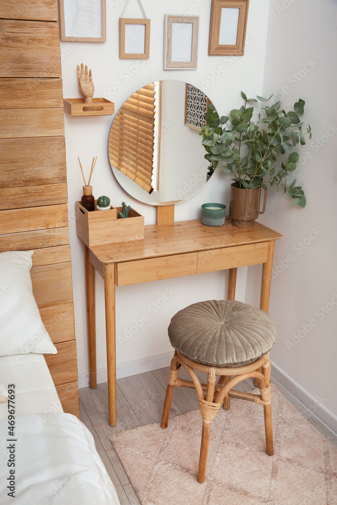 Canvas Prints Stylish dressing table and mirror near white wall indoors. Interior design