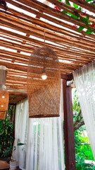 Brown dried weaved bamboo lamps hanging from the cailing